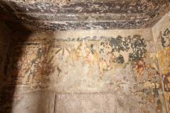 Ajanta Cave 2, porch, right cell, left wall. Bhuridatta, EPISODE 1: 'The king is sadly sitting in his palace, while his daughter is taken in a palanquin, escorted by armed men, through the demon-infested wilderness to the realm of Nagas.' (#61, Schlingloff 2013, vol. I, 288)