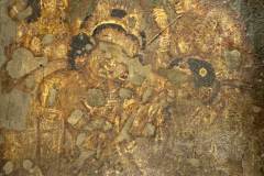 Ajanta Cave 2, hall, right wall. Purna, EPISODE 2: 'The sick merchant, leaning on the maid-servant's shoulders, is receiving from her a drinking-bowl with medicine.' (#79, Schlingloff 2013, vol. I, 447)