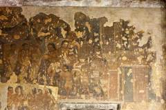 Ajanta Cave 2, hall, right wall. Purna, EPISODE 9: 'Outside the monastery, the Buddha, who with his monks has come flying through the air to Purna's hometown, is being welcomed by the townspeople with offerings.' Below left: episode 1. (#79, Schlingloff 2013, vol. I, 449)